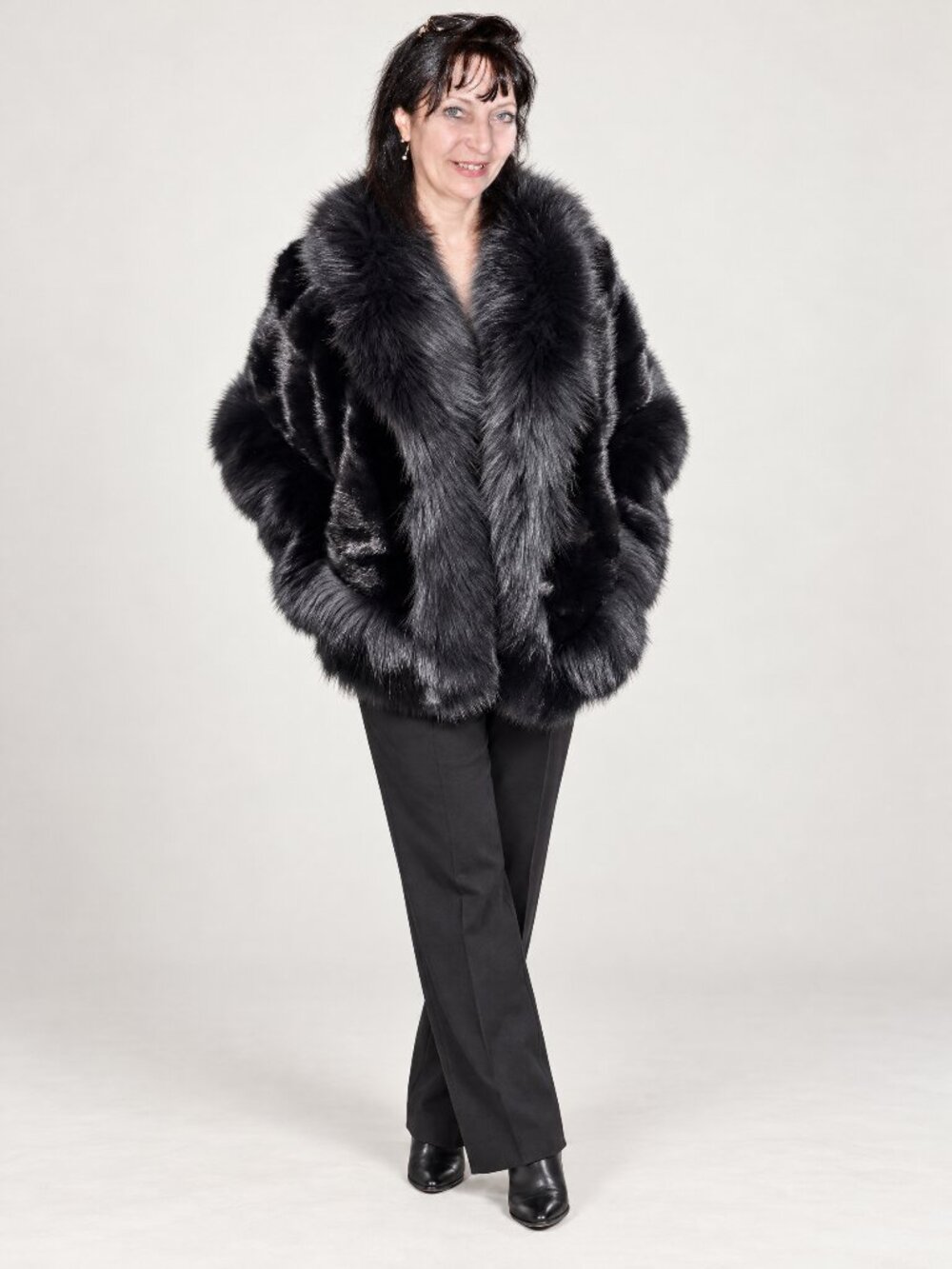 Fur cape-poncho combining mink fur with fox fur trim. Brand: unknown.